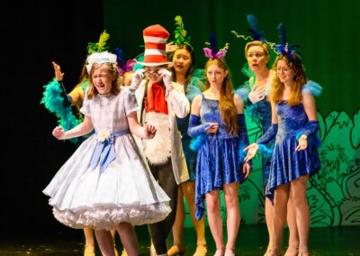 Emily Menell as Gertrude McFuzz and Isla Beltzner as Cat in the Hat plucking out Gertrude's Tail in Seussical
