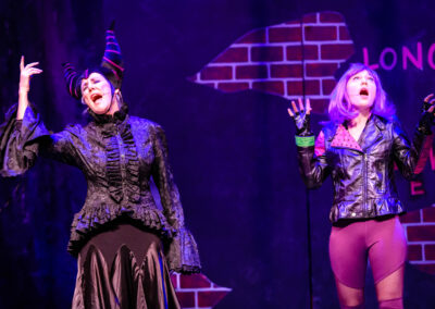 Susan Melanson as Maleficent, and Emily Menell as Mal, singing Evil Like Me in Pied Piper Players production of Disneys Descendants the Musical
